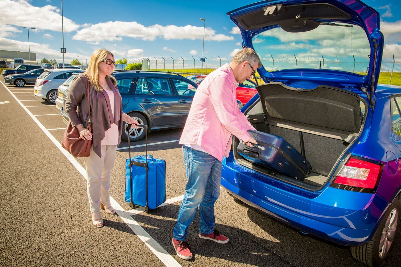 Grandparents loading the car for a trip